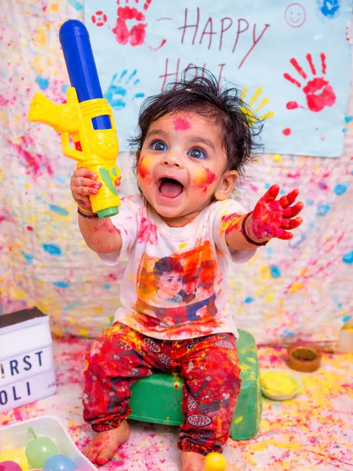 Holi 2026 Special Cute Baby Toddler on Green Stool & Large Pichkari AI Prompts